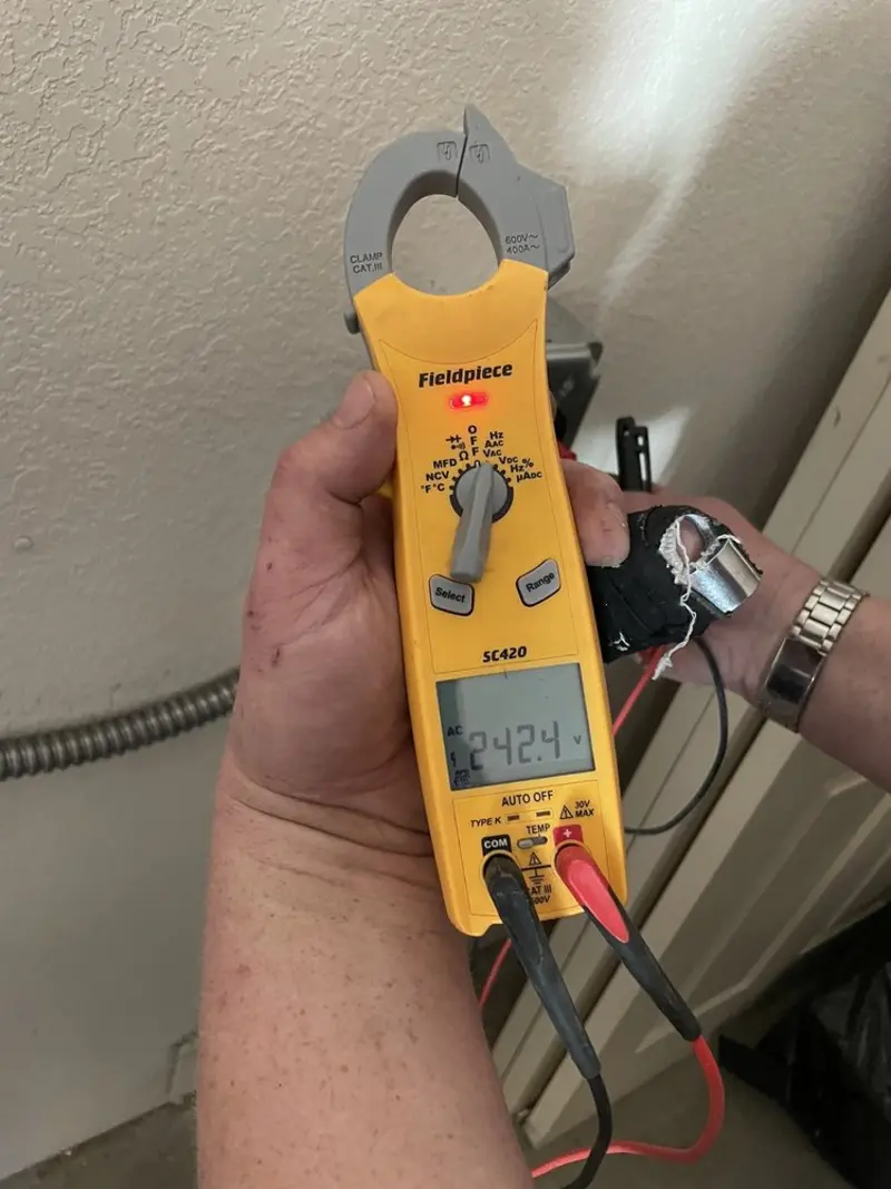 Voltage testing with clamp meter during Whole House Surge Protector in Ashland